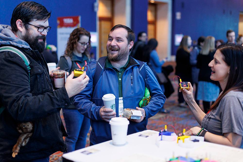 Teachers observing educational technology tools during poster sessions at TCEA Convention.