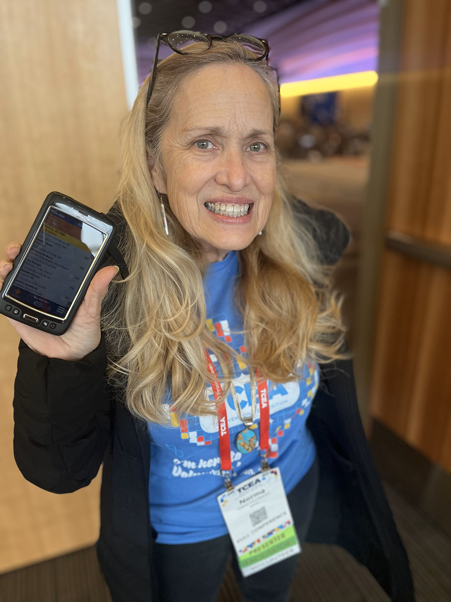 TCEA Volunteer and Member: Norma showing us the convention mobile app.