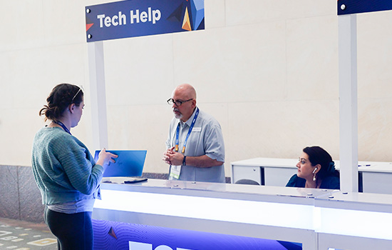 TCEA staff helping an attendee at the TCEA Convention & Exposition.