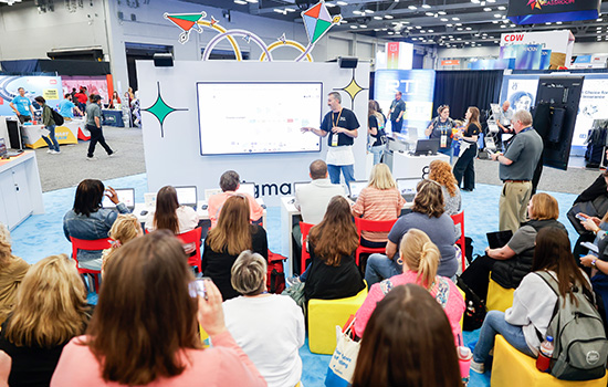 An ed tech exhibitor showcases their products at the TCEA Convention & Exposition in the exhibit hall.